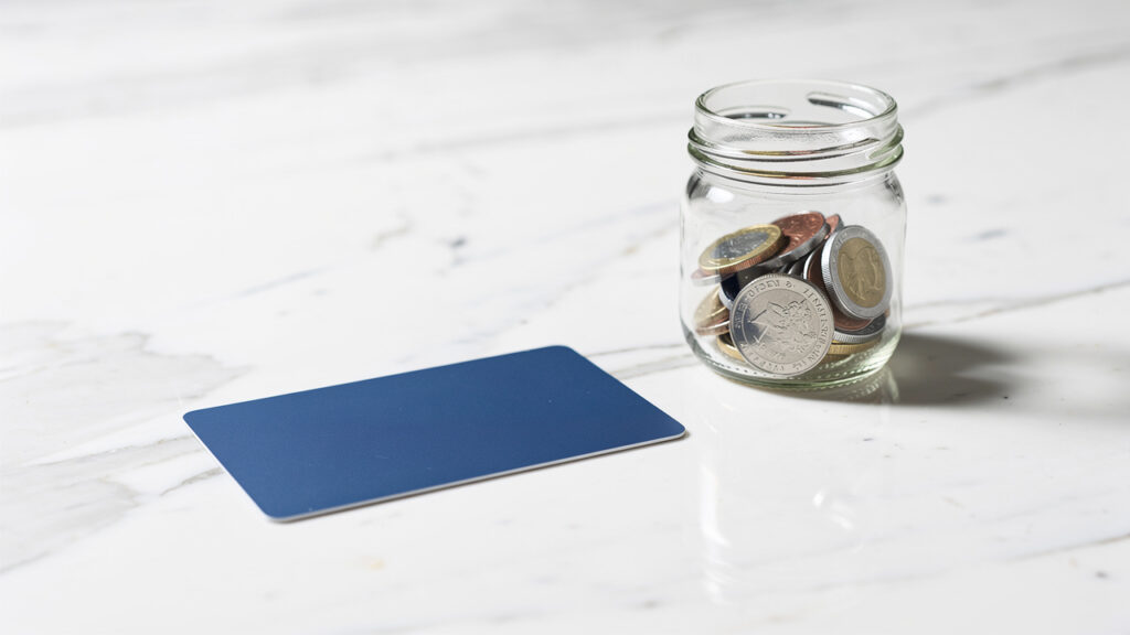 Secured credit card and savings jar for credit rebuilding